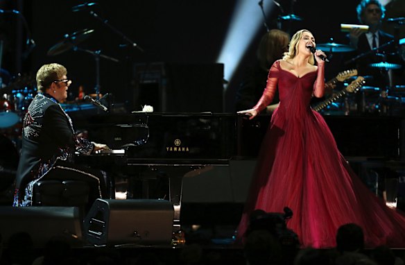 Elton John and Miley Cyrus perform <i>Tiny Dancer</i> at the 60th annual Grammy Awards.