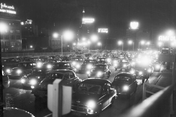 Cars experience a massive hold up on the Sydney Harbour Bridge on the night of July 1, 1959, just hours before the opening of the new lanes.