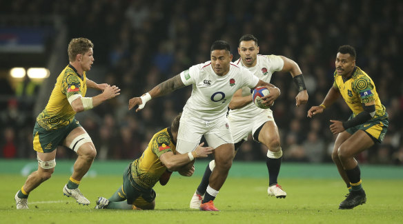 England's Manu Tuilagi powers through the defence. 