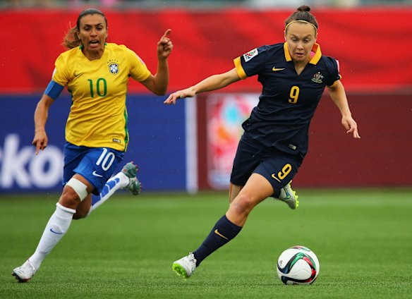 Marta of Brazil chases Caitlin Foord of Australia.
