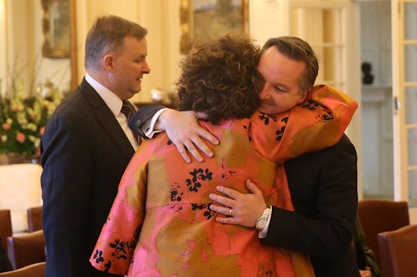 Therese Rein hugs Chris Bowen at Government House in Canberra on Thursday 27 June 2013.