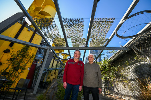 Geoff Beech (left) and Lloyd Godman below their shade screen on the Council House 2 building roof.