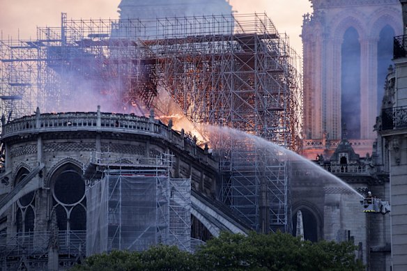 A massive fire is ripping through the cathedral in central Paris, toppling the spire on the 850-year-old Gothic monument.