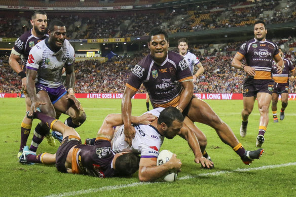 Centre Will Chambers scores for Melbourne against the Broncos.