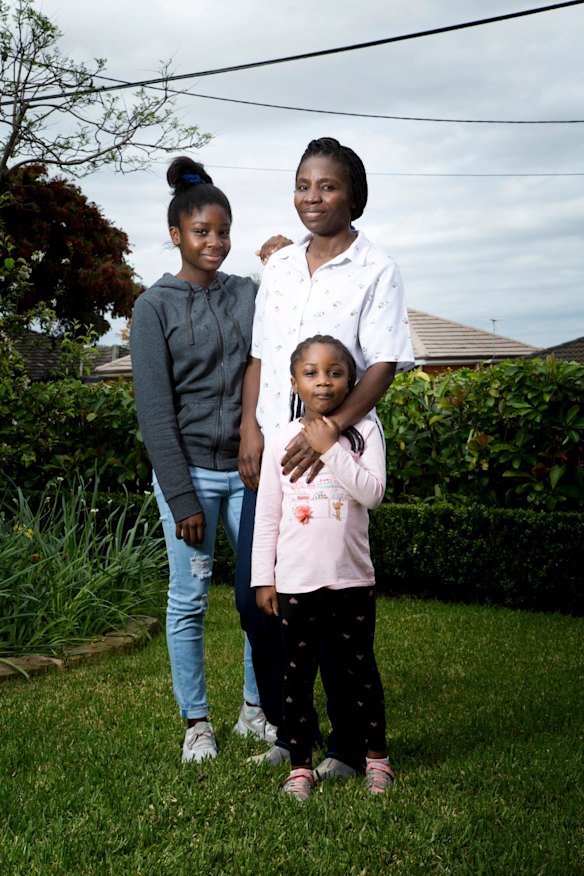 Victoria Kisanga leader of the Azande Community Association, with her Daughts (left) Mercy Kisanga 12, and Abigail Kisanga, 5.