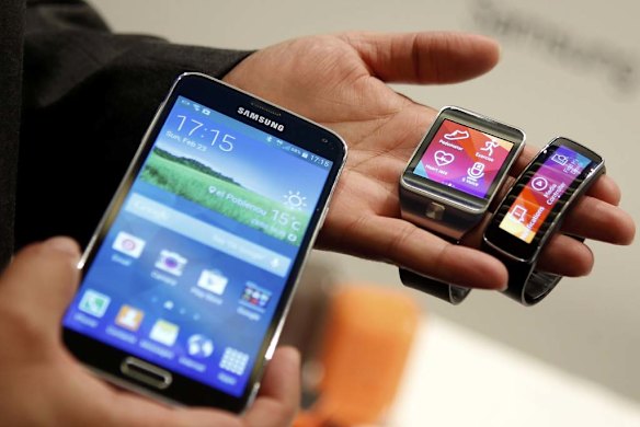 The line-up: (From left) the Galaxy S5 smartphone, Gear 2 smart watch and Gear Fit fitness band.