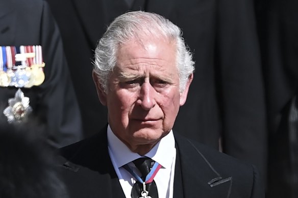 Prince Charles sheds a tear as he follows the coffin.
