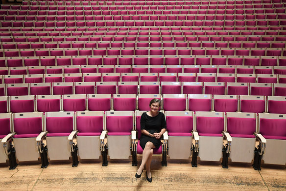 Sydney Opera House CEO Louise Herron sits in the Concert Hall of the Sydney Opera House, in seats by architect John Rourke.