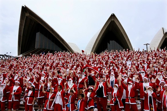 Photograph shows participants in the Variety Santa Run from Darling Harbour to the Sydney Opera House. 28th November 2010.