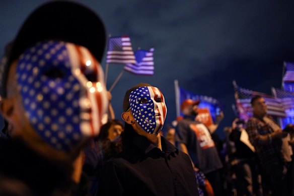 Supporters of President Donald Trump protest in front of the Clark County Election Department after in North Las Vegas, Nevada.