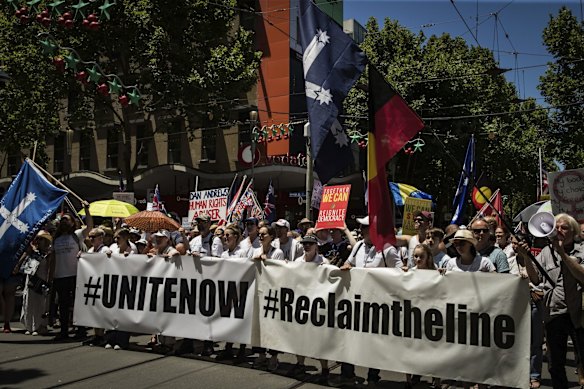 Protesters attend the Melbourne Freedom rally in the CBD