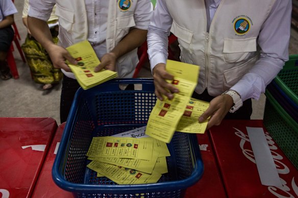 Votes are counted in an unfinished building being used as a polling station in Yangon, Myanmar.