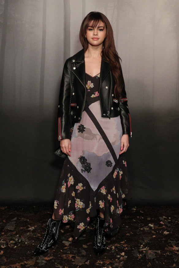 Selena Gomez demonstrates the high-low versatility of a floral dress at Coach at New York Fashion Week.