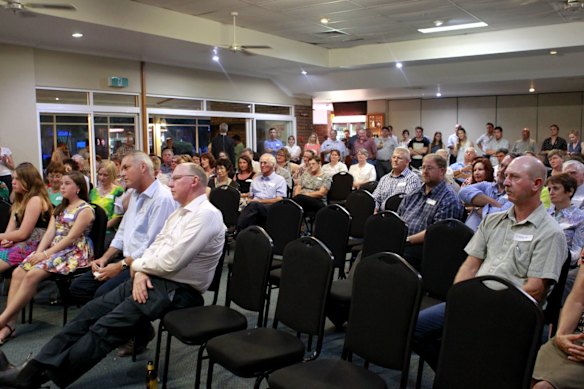 A crowd listen to Gregory MP Vaughan Johnson's farewell speech in Emerald.  .