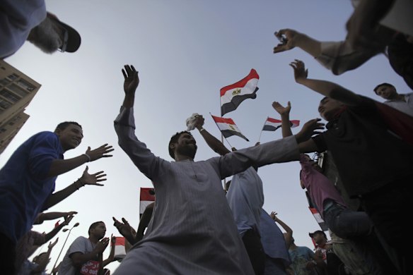 Celebrations in front of the Republican Guard headquarters in Cairo after President Mursi was removed from power.