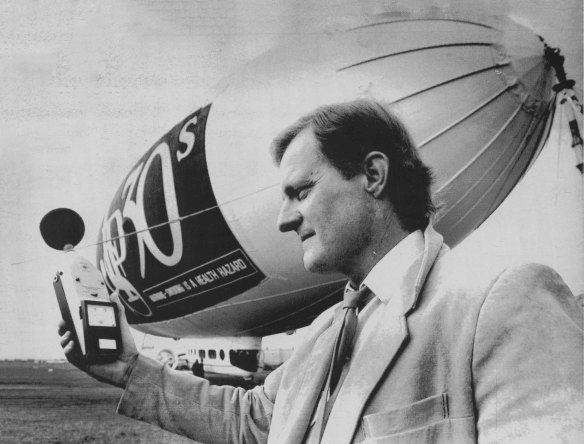 Rod Stevens of the State Pollution Control Commission tests the level of noise emitted from the Bond airship on August 7, 1987.