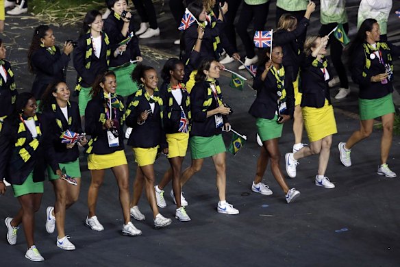 Brazil's athletes carry the national and British flags.
