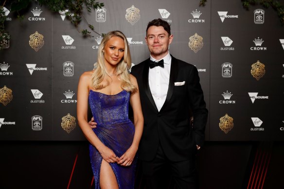 Lachie Neale, pictured with wife Julie, was in the thick of the counting action on Sunday night, and had the lead after round 11.
