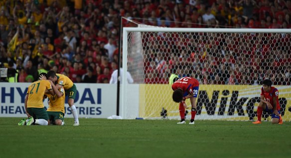 The Socceroos celebrate their victory.