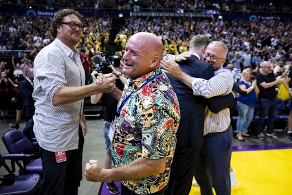 Paul Smith is congratulated by former NBA champion with the Chicago Bulls, Luc Longley.