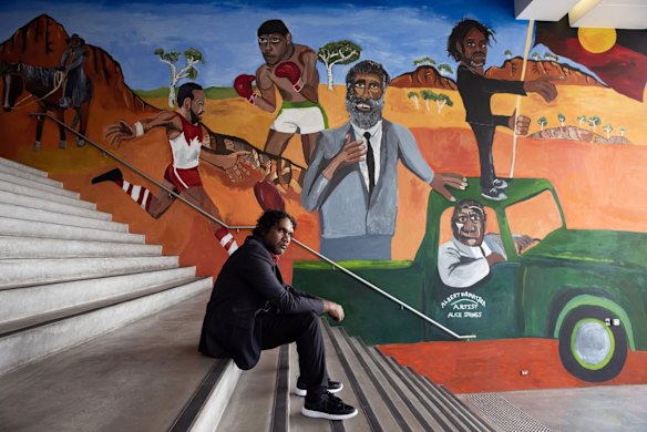 Vincent Namatjira, P.P.F. (Past-Present-Future), 2021.
Vincent Namatjira’s semi-autobiographical and political work is an assertion of identity, sovereignty, pride and resilience for the 2021 Circular Quay Foyer Wall Commission.