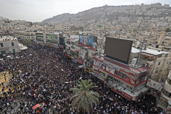 Broad following: Mourners gather in the West Bank town of Nablus to bury Lions’ Den militants killed by Israeli forces in October 2022.