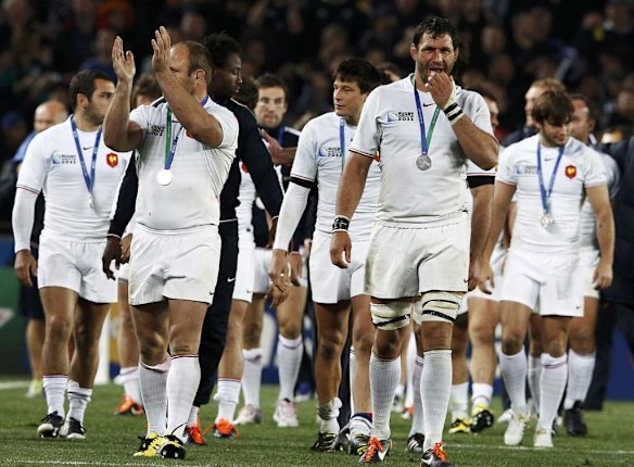 France players applaud the crowd as they display their runners-up medals.