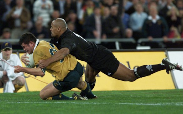 Jonah Lomu fails to stop Jeremy Paul from scoring with minutes to go in the game.