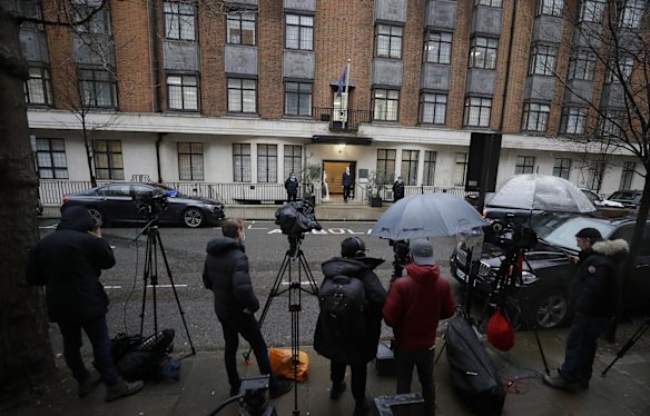 Television crews gather outside King Edward VII's hospital in London, Wednesday, Feb. 17, 2021. Buckingham Palace says 99-year-old Prince Philip has been admitted to a London hospital after feeling unwell.