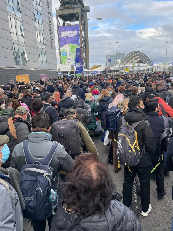 Thousands queue to enter the SEC in Glasgow hours before the opening ceremony of the UN climate talks.