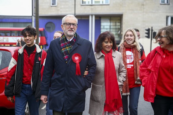 Jeremy Corbyn, leader of the Labour party, second left, departs with Laura Alvarez, his wife, after they cast their votes in the U.K. general election at a polling station in London, U.K., on Thursday, Dec. 12, 2019. The U.K. votes on Thursday to determine whether Prime Minister Boris Johnson gets the mandate he wants to "get Brexit done," or Corbyn replaces him in 10 Downing Street to pursue his "radical agenda" of wealth redistribution and nationalizations. 
