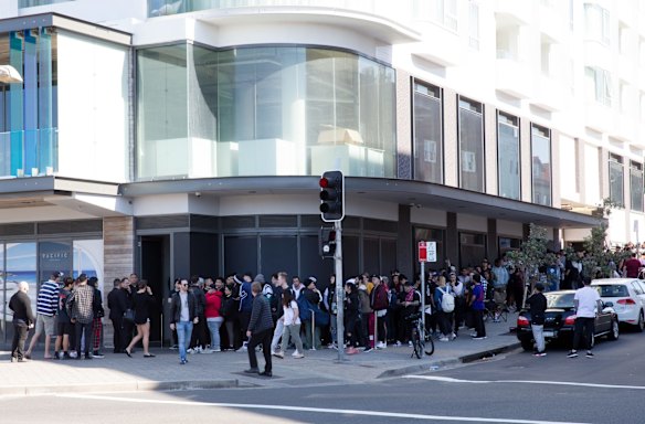Kanye West fans line up for the opening of his pop up clothing store in Bondi, Sydney. 