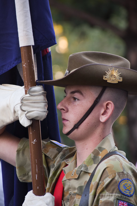 An Australian Army cadet holds the flagpole during the Anzac Day March. 