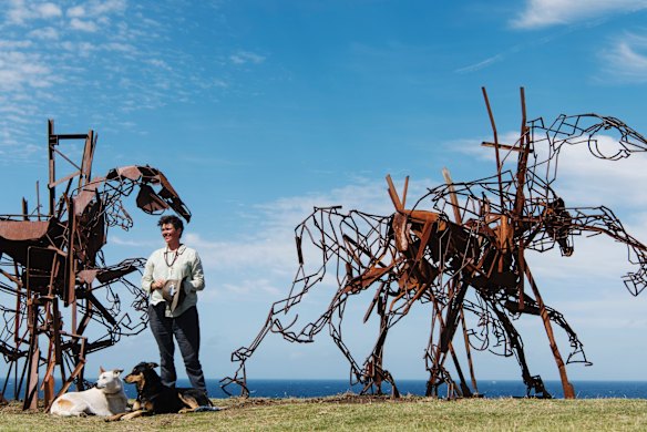 Artist Harrie Fasher with her finished work, The Last Charge