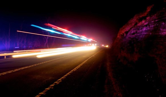 RFS fire crews moving along the Bells Line of Road west of Mt Tomah last night as fire threatened to jump the road from ember attack.