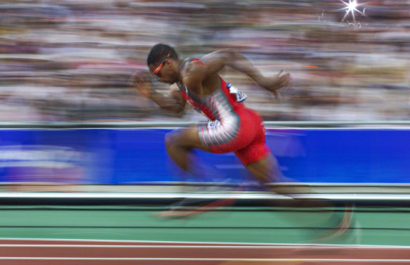 Ato Bolden runnning at the Sydney Olympics.