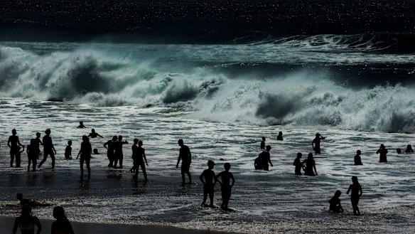 Swimmers hit the beach at Merewether to avoid the heat.