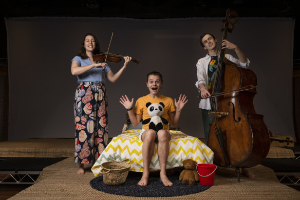 Actor Jack Richardson (centre) with musicians Sonia Wilson and Adrian Whitehall on set for the There’s a Sea in my Bedroom, an Australian Chamber Orchestra theatre production. 