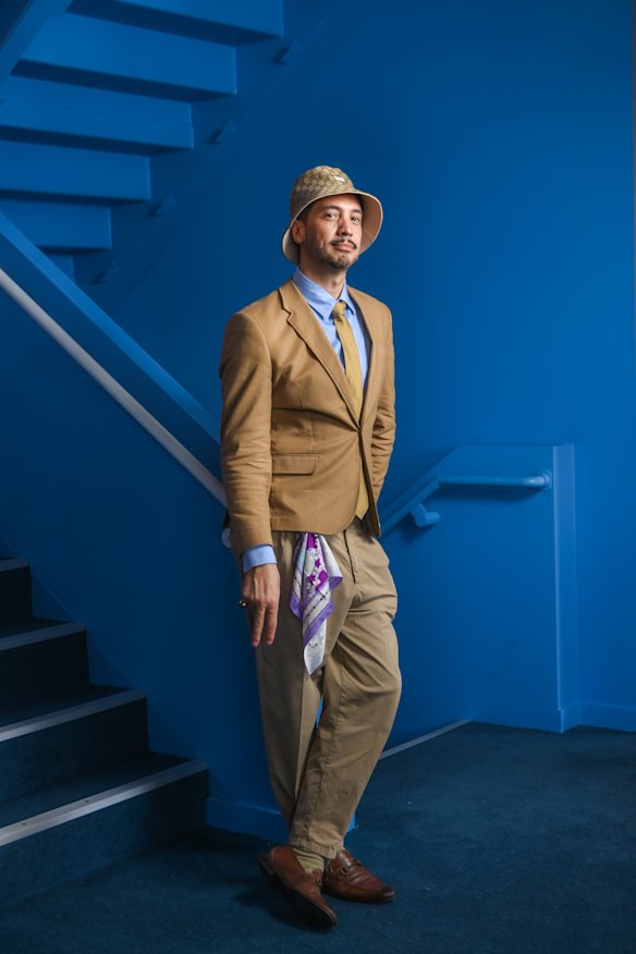 Artist Justin Miano in the Landmark by Lexus pavilion in the Birdcage.