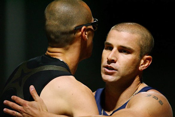 Embracing Jeremy Wariner of the USA after the Mens 200 metre race during the Sydney Athletics Grand Prix held at Sydney Olympic Park on February 16, 2008.