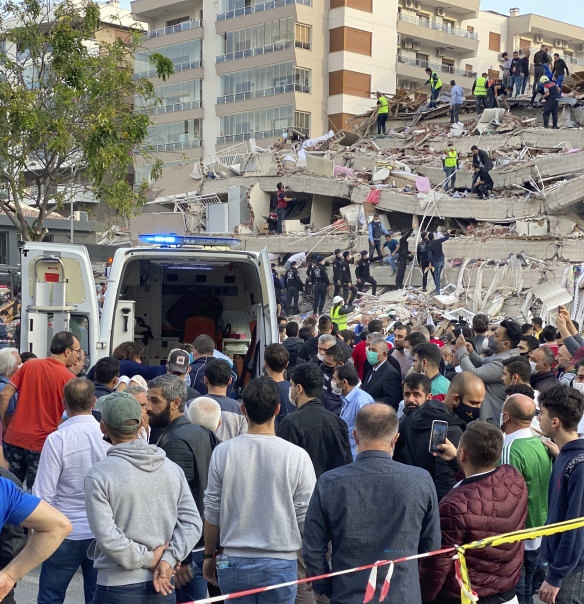 Rescue workers were attempting to find survivors in the rubble of a collapsed building in Izmir.