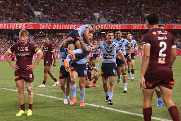 Jerome Luai of the Blues and Tariq Sims of the Blues celebrate after a try scored by Brian To'o of the Blues during game one of the 2021 State of Origin series.