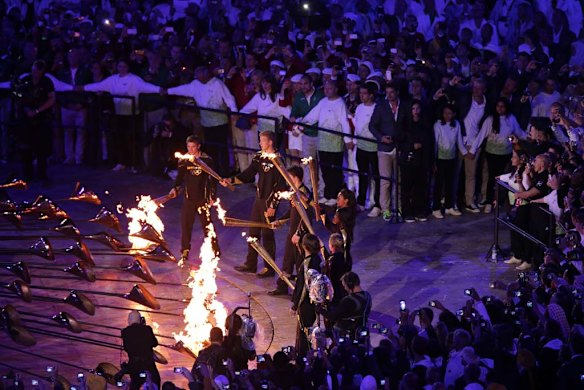 Night to remember ... young athletes light the flame.