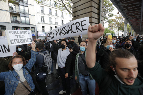 Demonstrators in Paris hold banners during a banned protest in support of Palestinians on Saturday. 