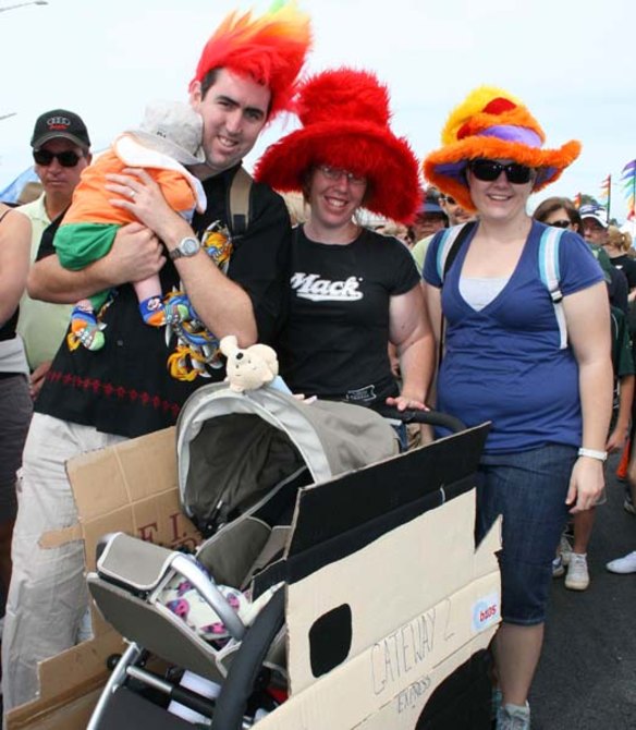 Scott McKenzie with 11-week-old son Sebestyen, along with Sammie and Emma McKenzie and their cardboard box-crafted "first vehicle on the new Gateway" complete with bumper sticker.