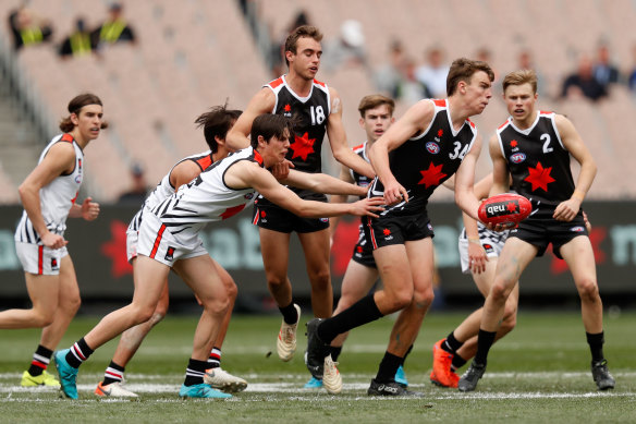 Riley Thilthorpe dishes off a handball in the 2019 NAB League All-Stars match.