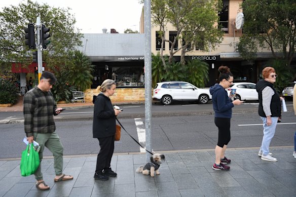 Voters line up outside Mona Vale Memorial Hall in the electorate of Mackellar to cast their vote in Sydney.