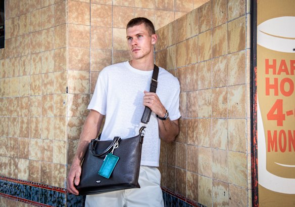 Australian accessories label Oroton has relaunched its male accessories line, capitalising on the popularity of handbags for men. Model Russell White gives an Oroton bag the pub test in Redfern.