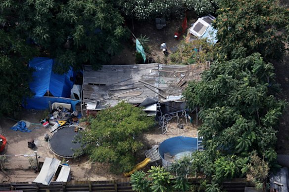 Tarps, tents and a wooden structure are seen in the backyard of alleged kidnapper Phillip Garrido.