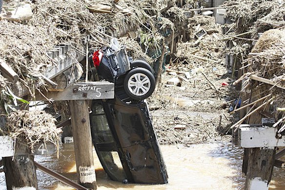 Emergency services search for bodies in the town of Grantham, in the Lockyer Valley, which was devastated by a sudden flood on January 10. Photo: Dean Saffron
